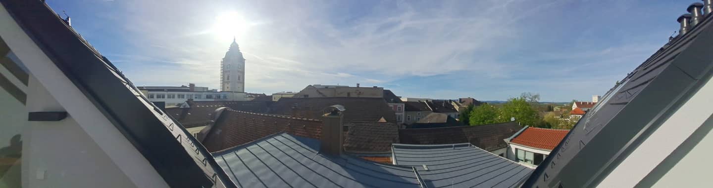 First occupancy - Roof terrace with town tower and distant view - Enns