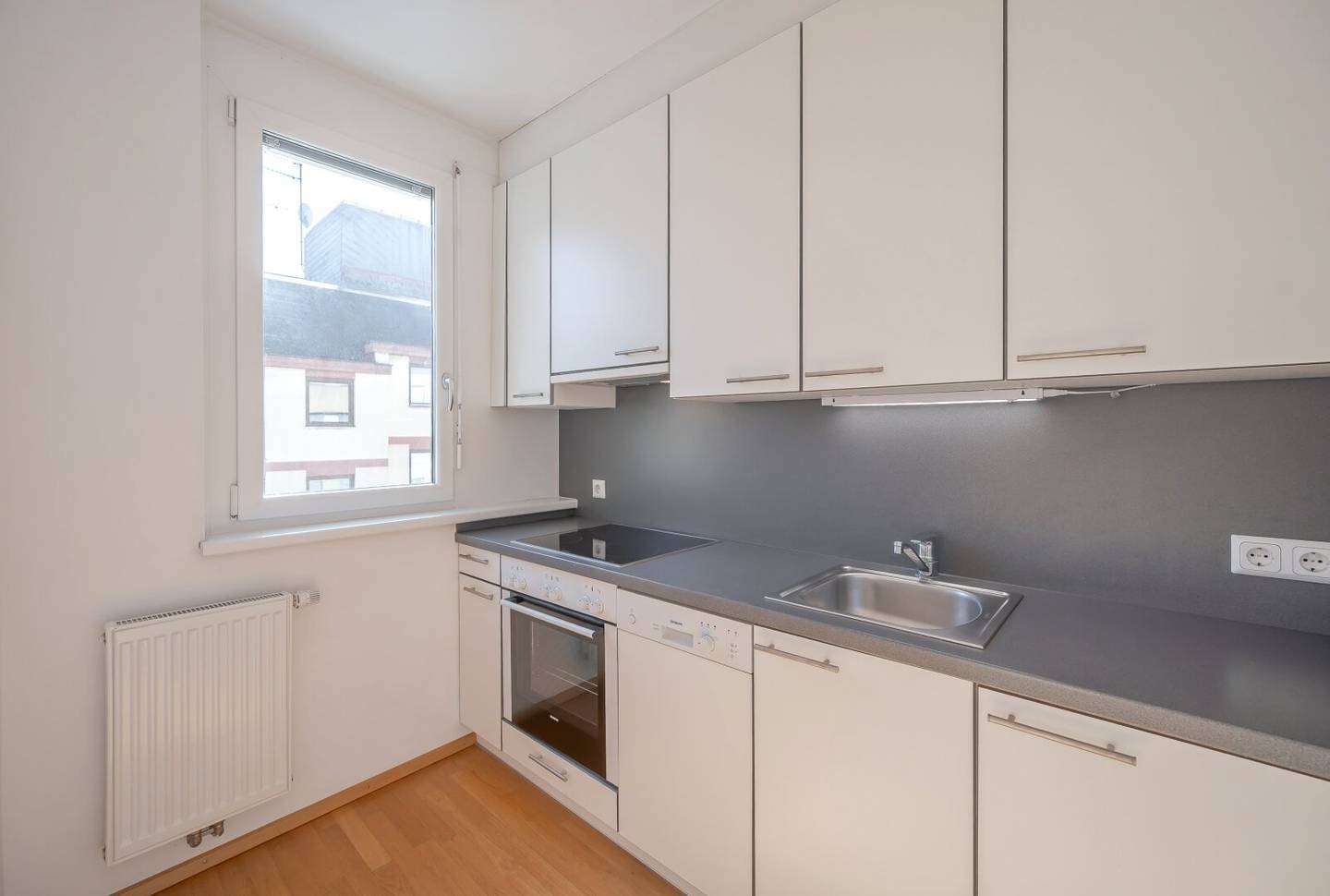 2-room new build apartment with balcony and underground parking space in prime location