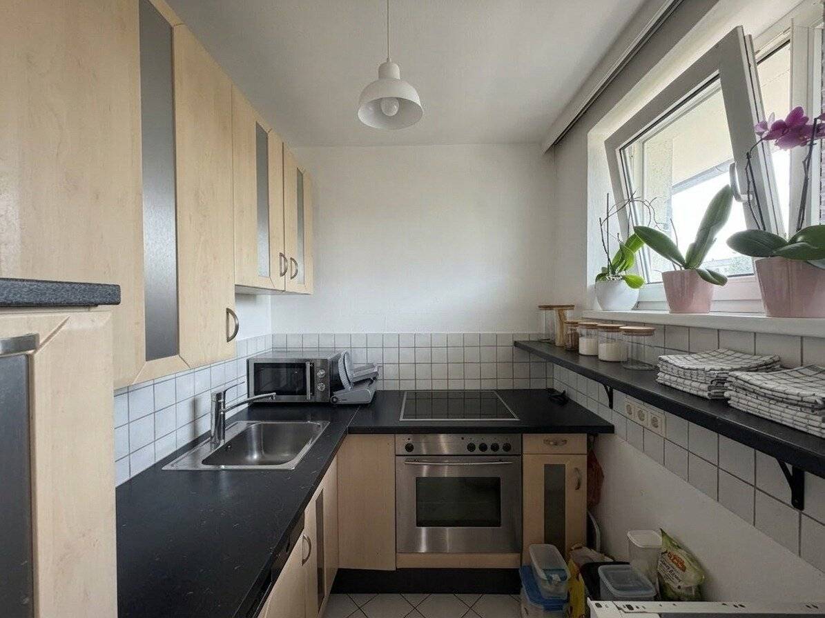 Rum: Helle Anlegerwohnung mit sonnigem, hofseitigem Südwestbalkon, Gemeinschaftsgarten und langfristiger Vermietung