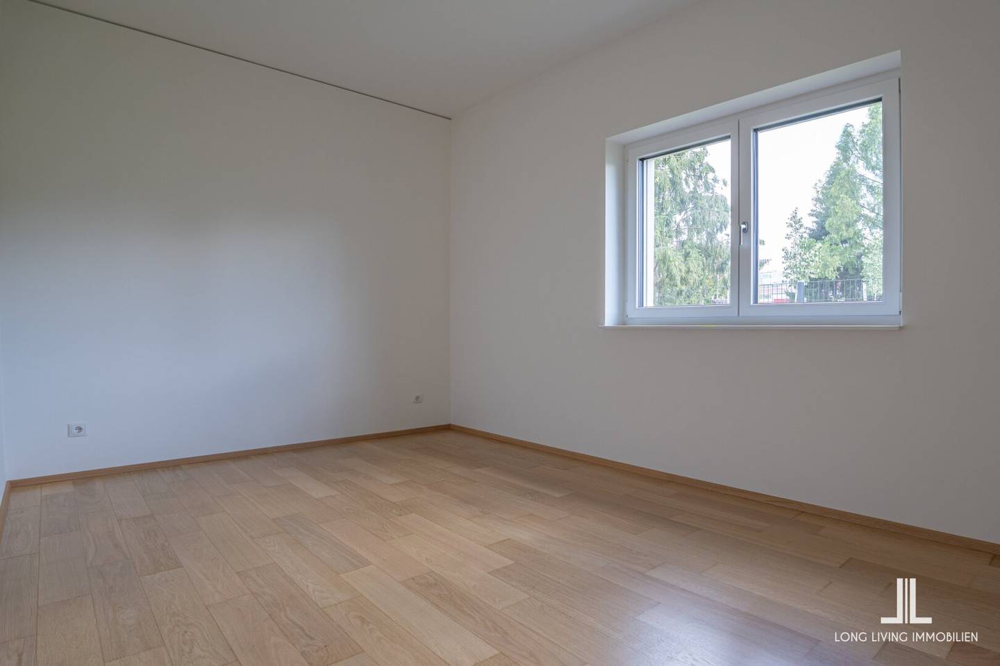 Modern und zentral wohnen – 3-Zimmer-Erdgeschosswohnung mit Westterrasse, Tiefgaragenplatz und gemeinschaftlicher Dachterrasse