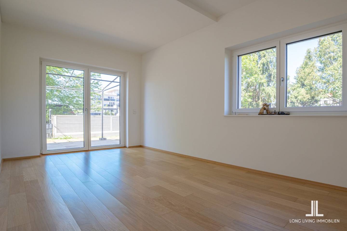 Modern und zentral wohnen – 3-Zimmer-Erdgeschosswohnung mit Westterrasse, Tiefgaragenplatz und gemeinschaftlicher Dachterrasse