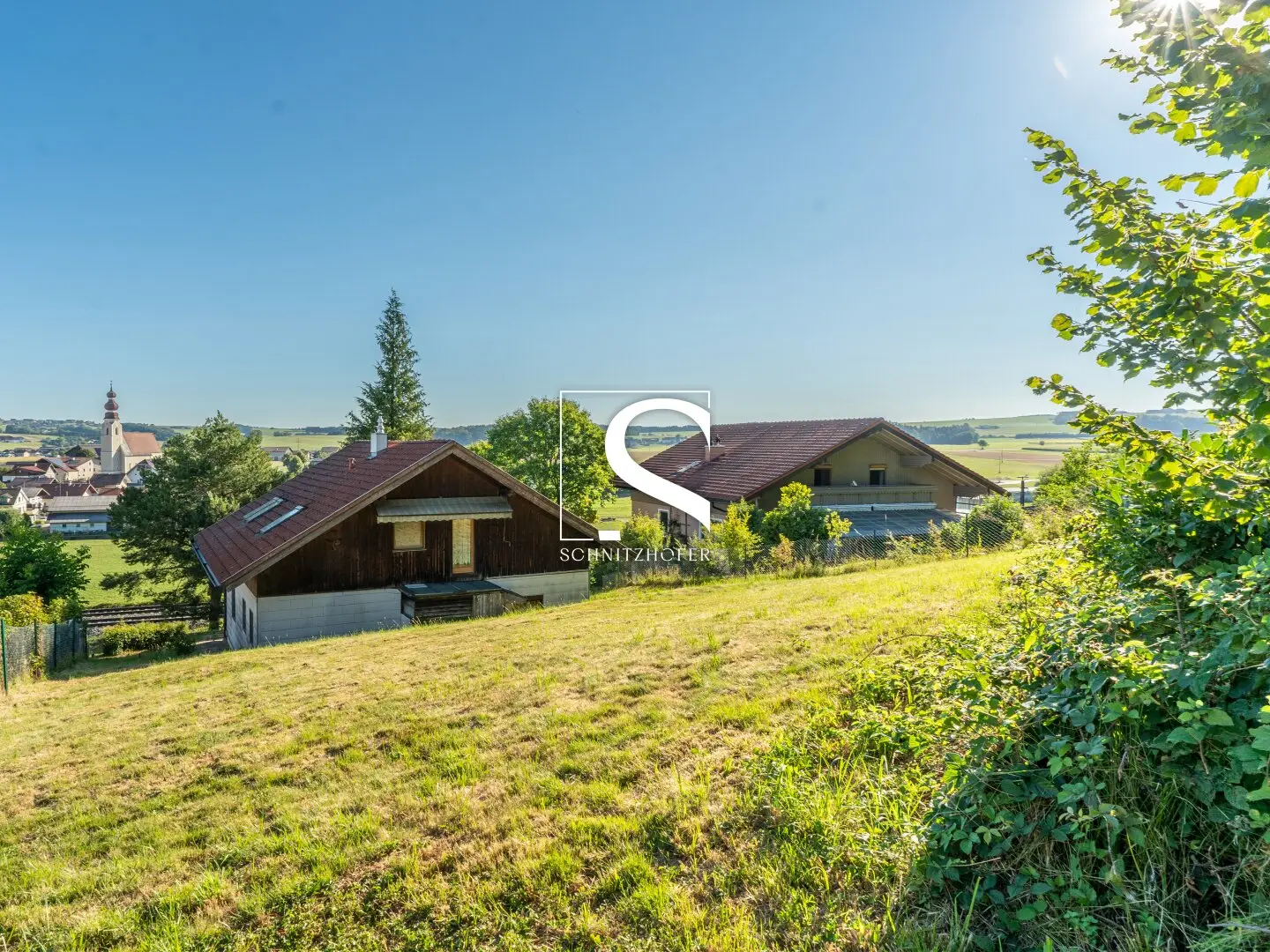 NEST with VIEW | Spacious hillside plot with existing building | Irrsdorf