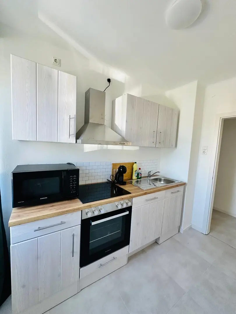 Hochwertig sanierte Wohnung mit Balkon und Gartennutzung