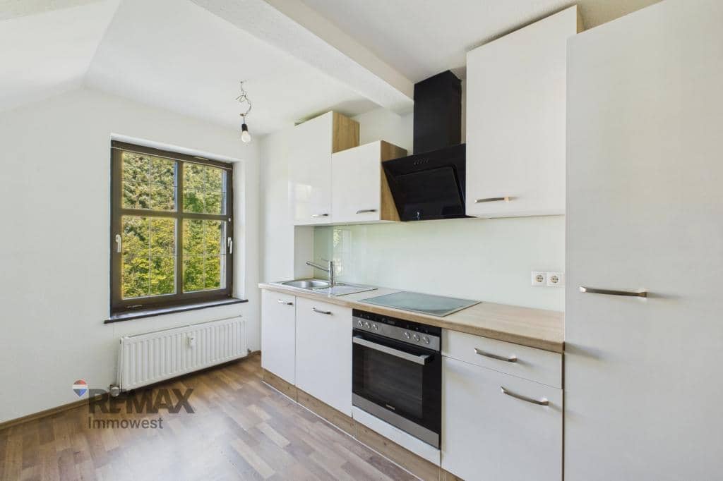 Dachgeschosswohnung mit Altbauflair und privatem Stellplatz