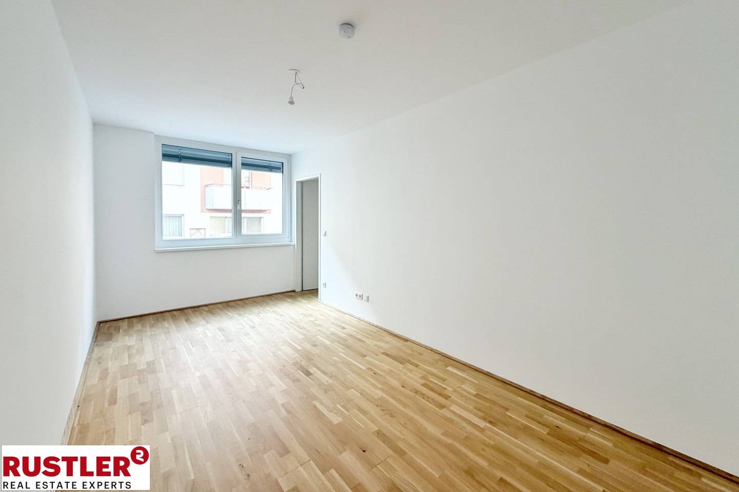 New build apartment in green setting with balcony