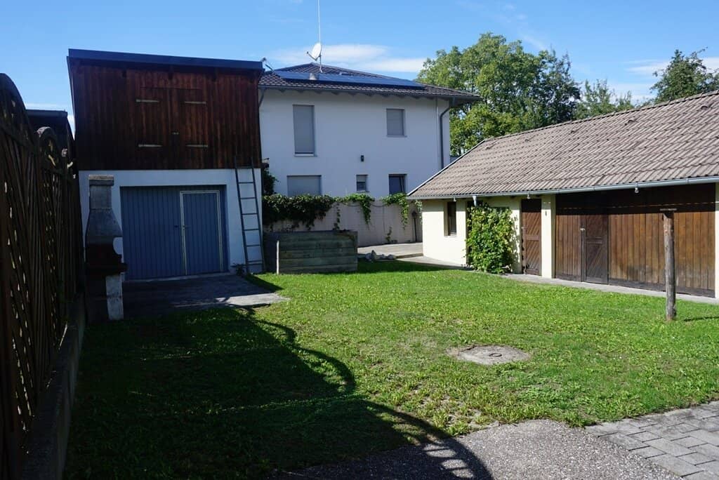 Coming soon: well-maintained two-family house with outbuilding and garage