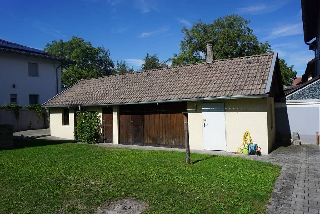 Coming soon: well-maintained two-family house with outbuilding and garage