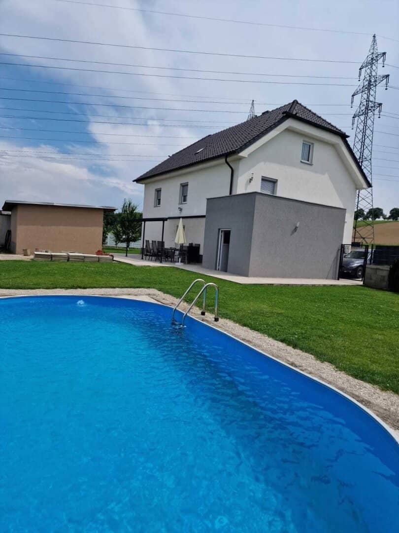 Fully renovated single or multi-family house with pool and additional green land