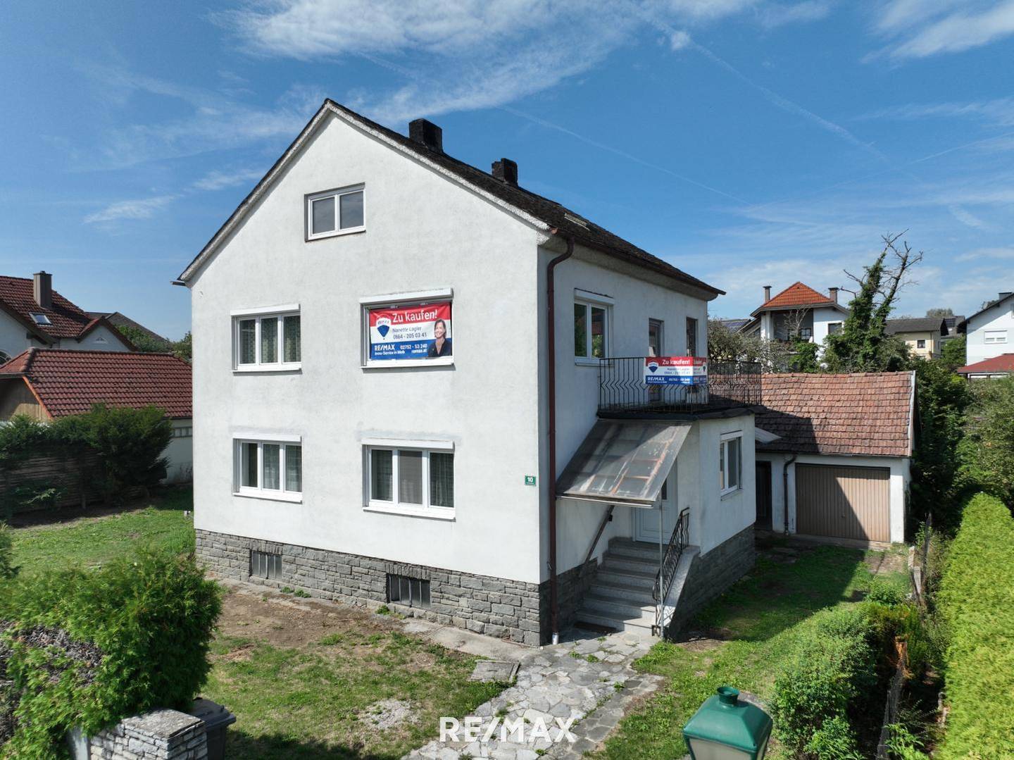 Wohnung auf großem Grundstück mit Garage