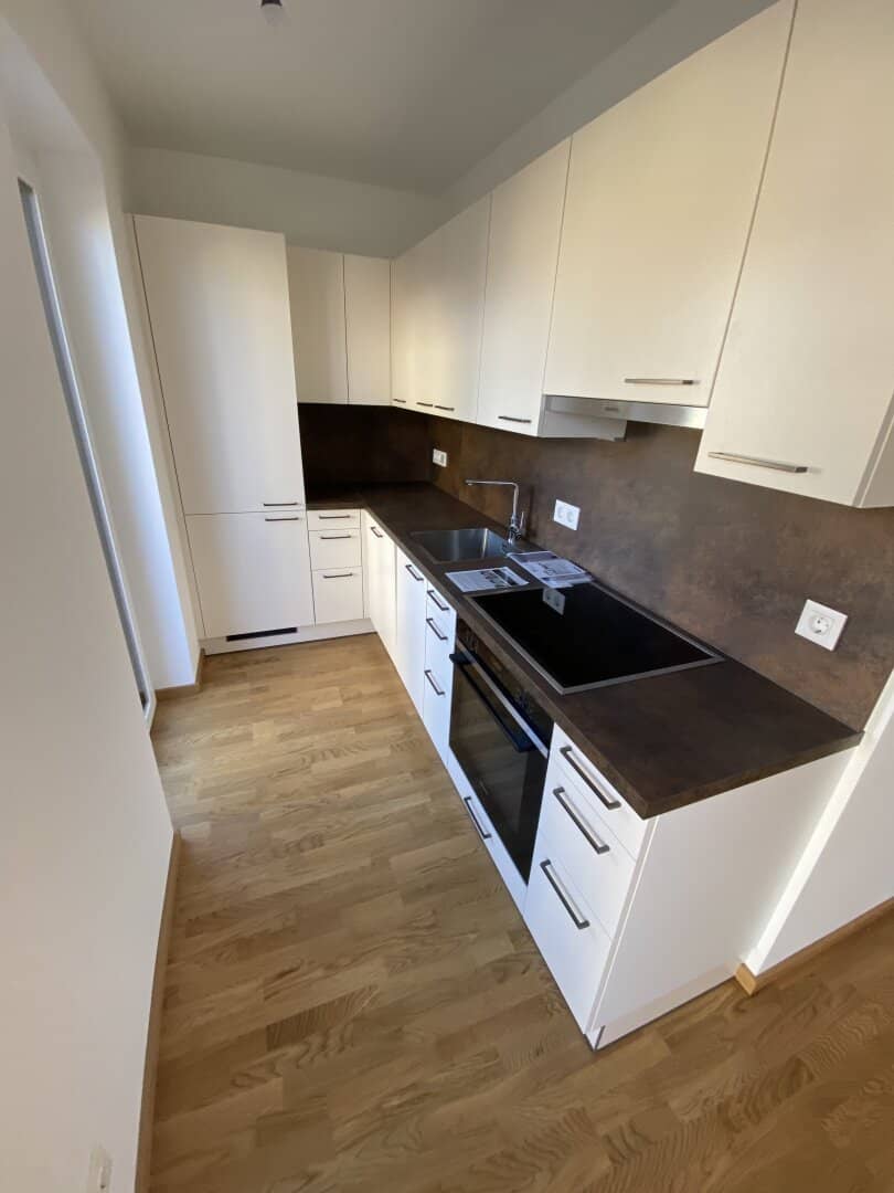 High-quality 2-room apartment with balcony and 2 garage spaces - first occupancy