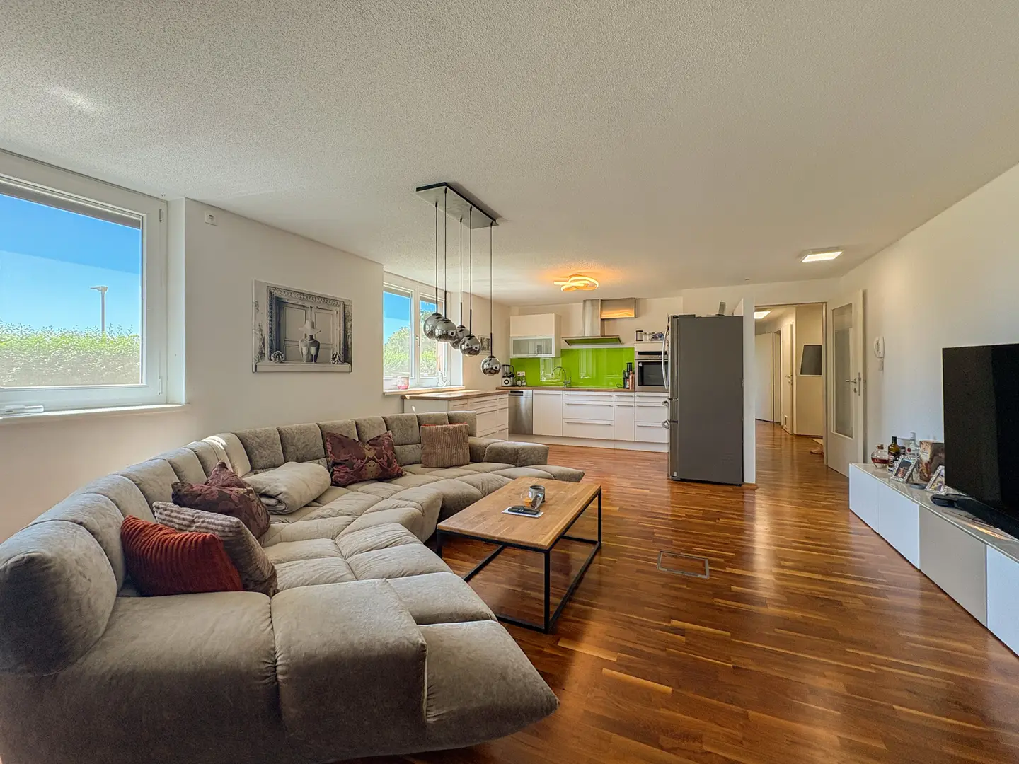 Light filled ground floor apartment with private garden and underground parking included