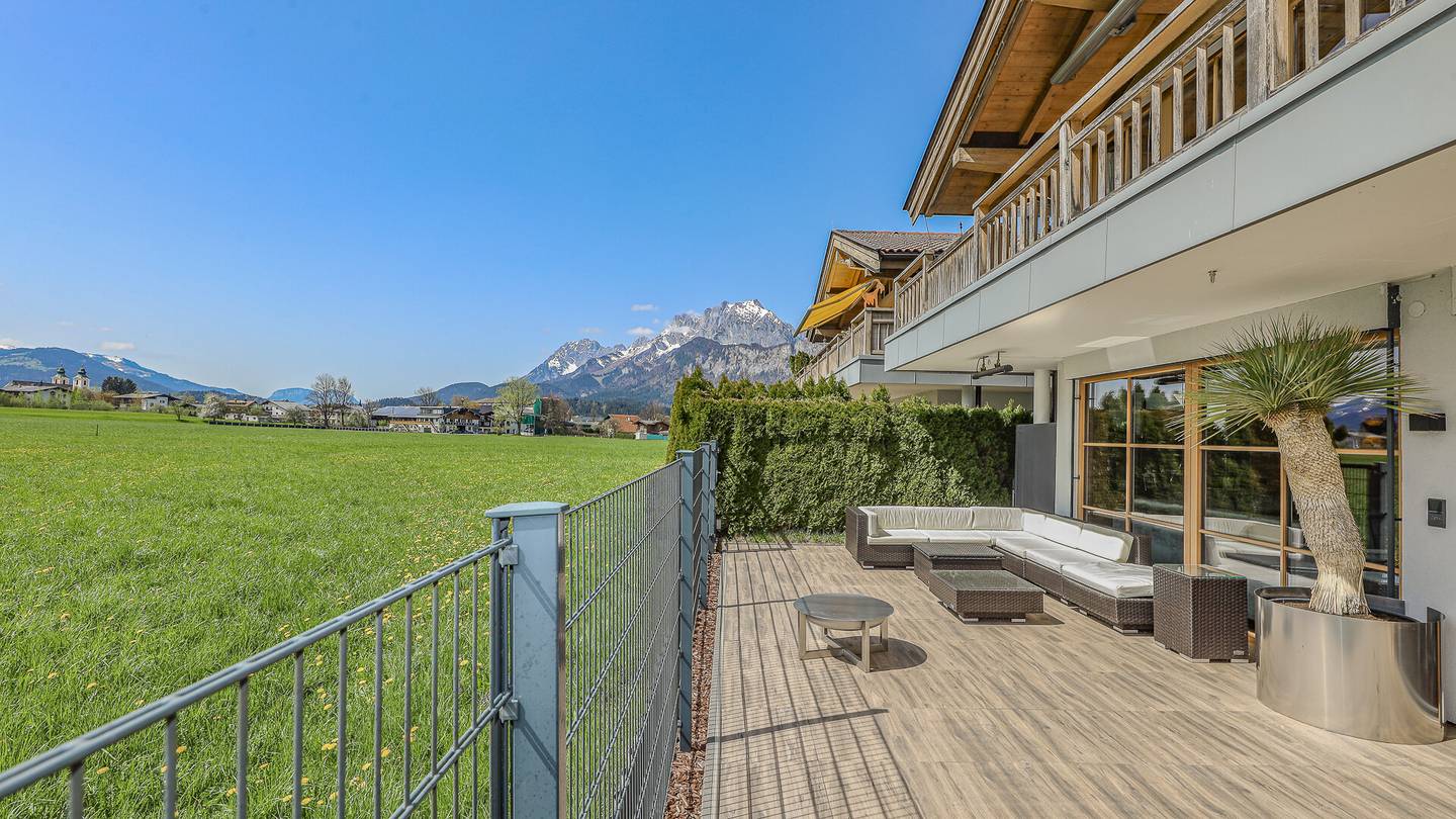 Erdgeschosswohnung mit Garten Sauna und Alpenblick