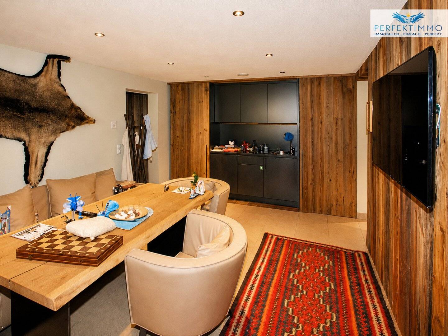 Alpines Wohn- und Apartmenthaus in exklusiver Pistenlage