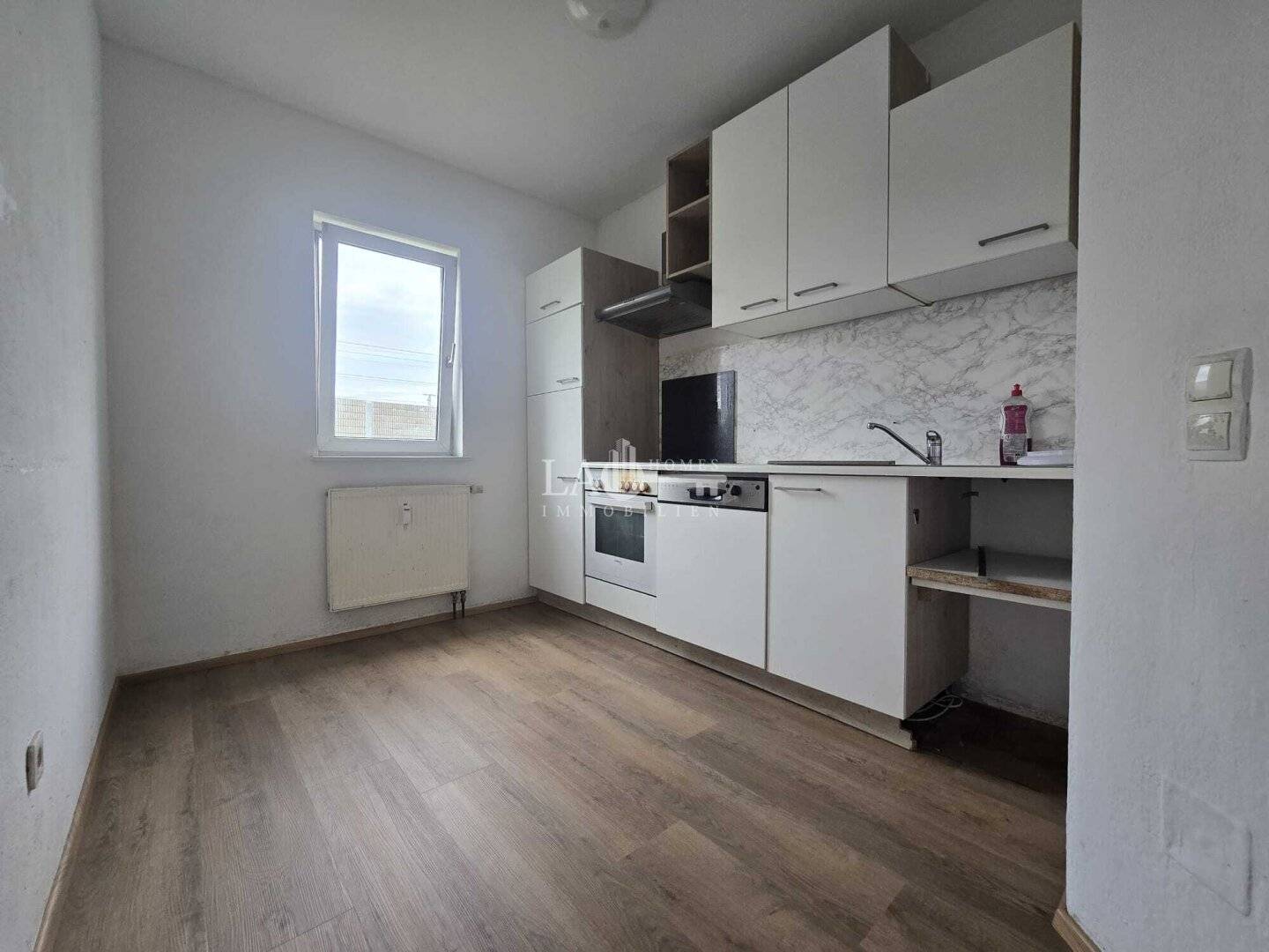 Charming 4-room apartment with balcony and parking