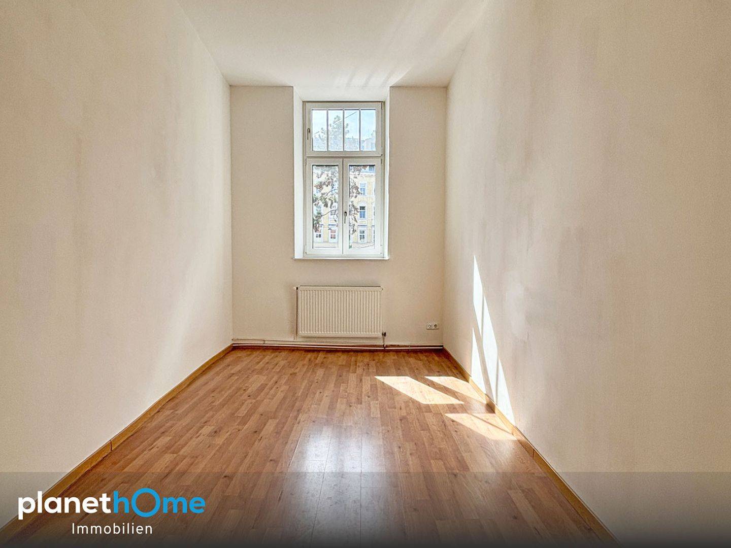 Bright apartment with large display windows in a well kept tenement