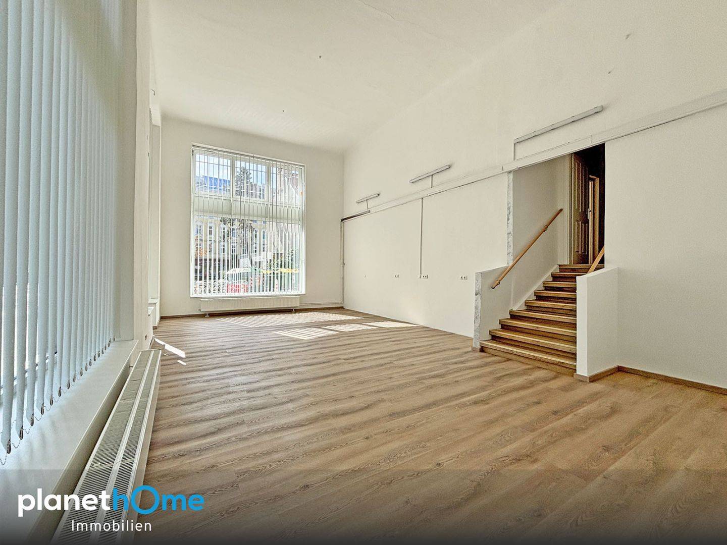 Bright apartment with large display windows in a well kept tenement
