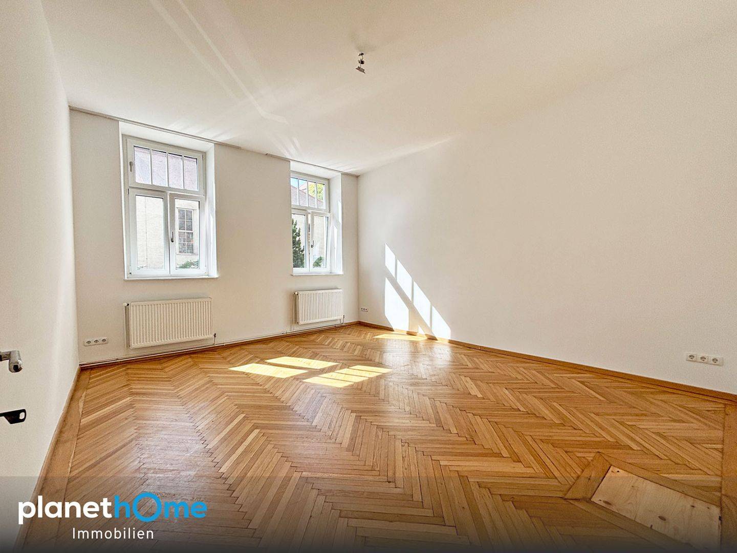 Bright apartment with large display windows in a well kept tenement