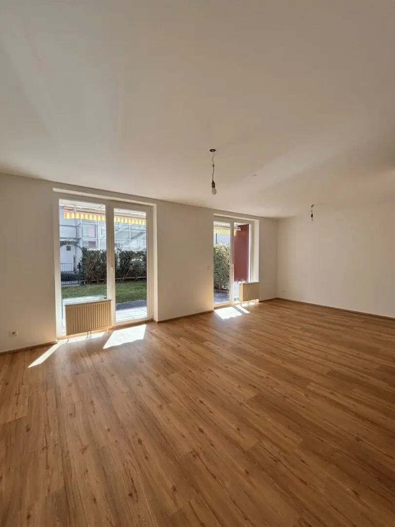 100 m² Wohngefühl auf zwei Ebenen | 4-Zimmer-Gartenmaisonette mit Südterrasse und Balkon | Inklusive Tiefgaragenstellplatz!