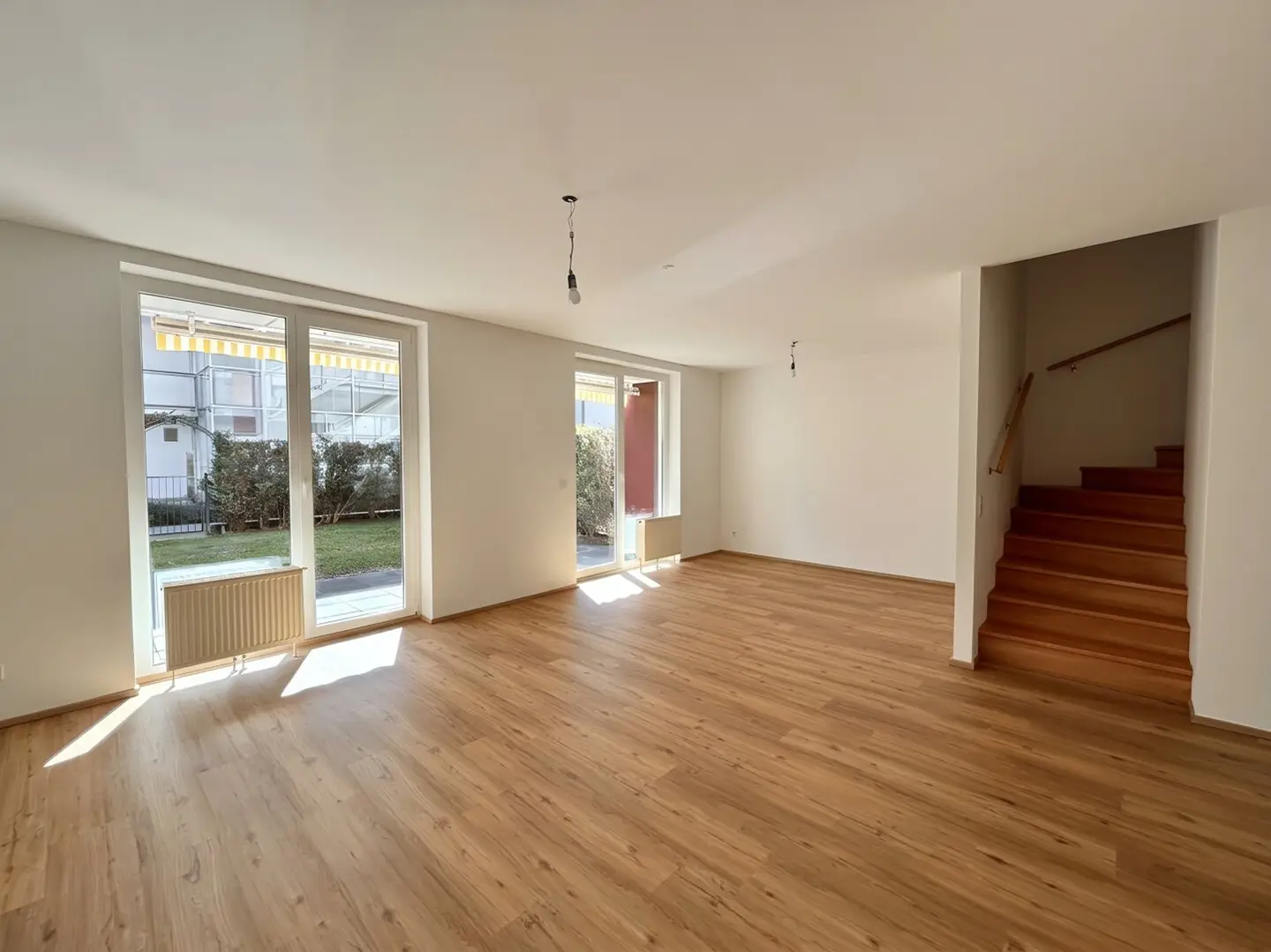 100 m² Wohngefühl auf zwei Ebenen | 4-Zimmer-Gartenmaisonette mit Südterrasse und Balkon | Inklusive Tiefgaragenstellplatz!