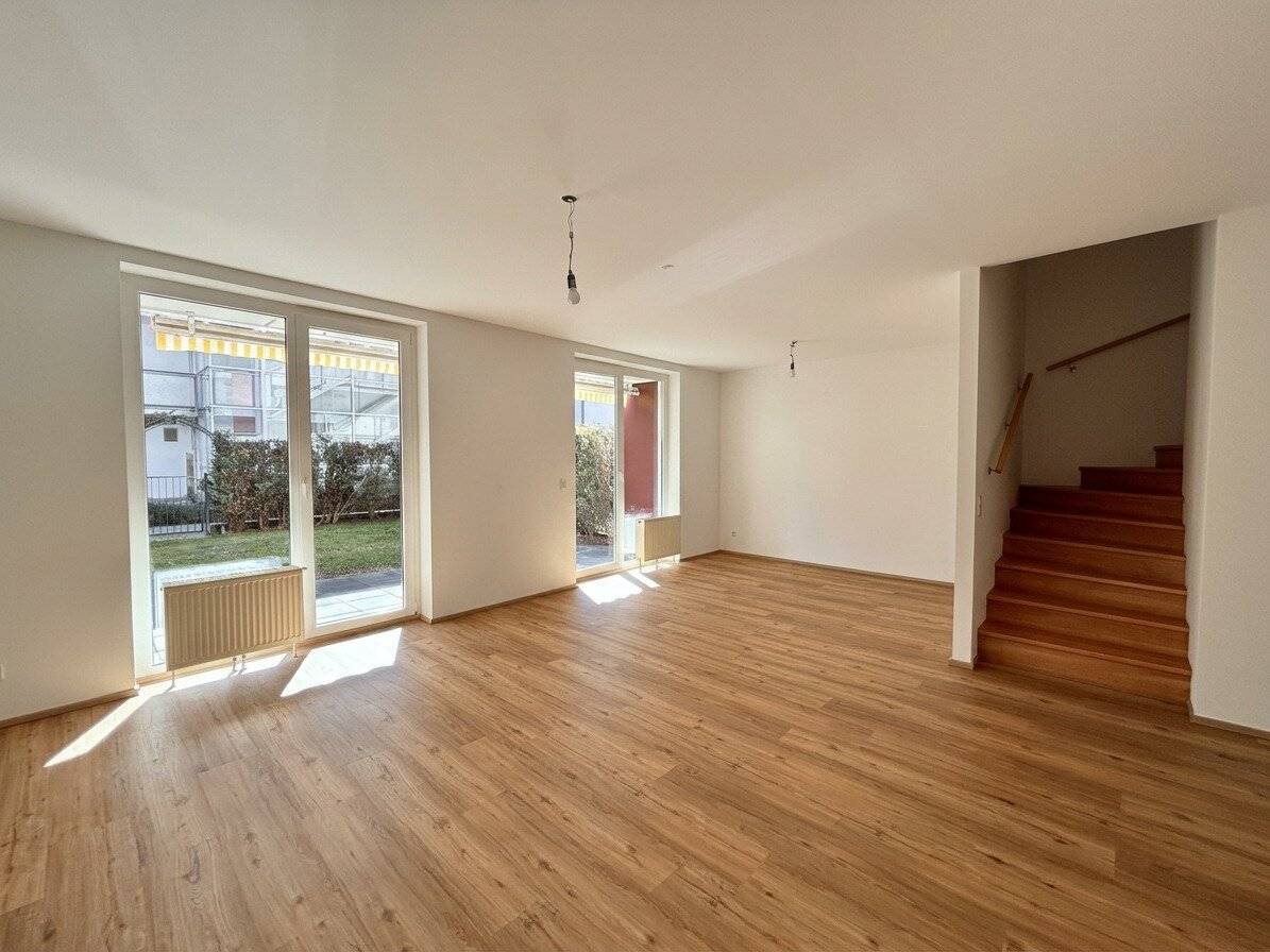 100 m² Wohngefühl auf zwei Ebenen | 4-Zimmer-Gartenmaisonette mit Südterrasse und Balkon | Inklusive Tiefgaragenstellplatz!