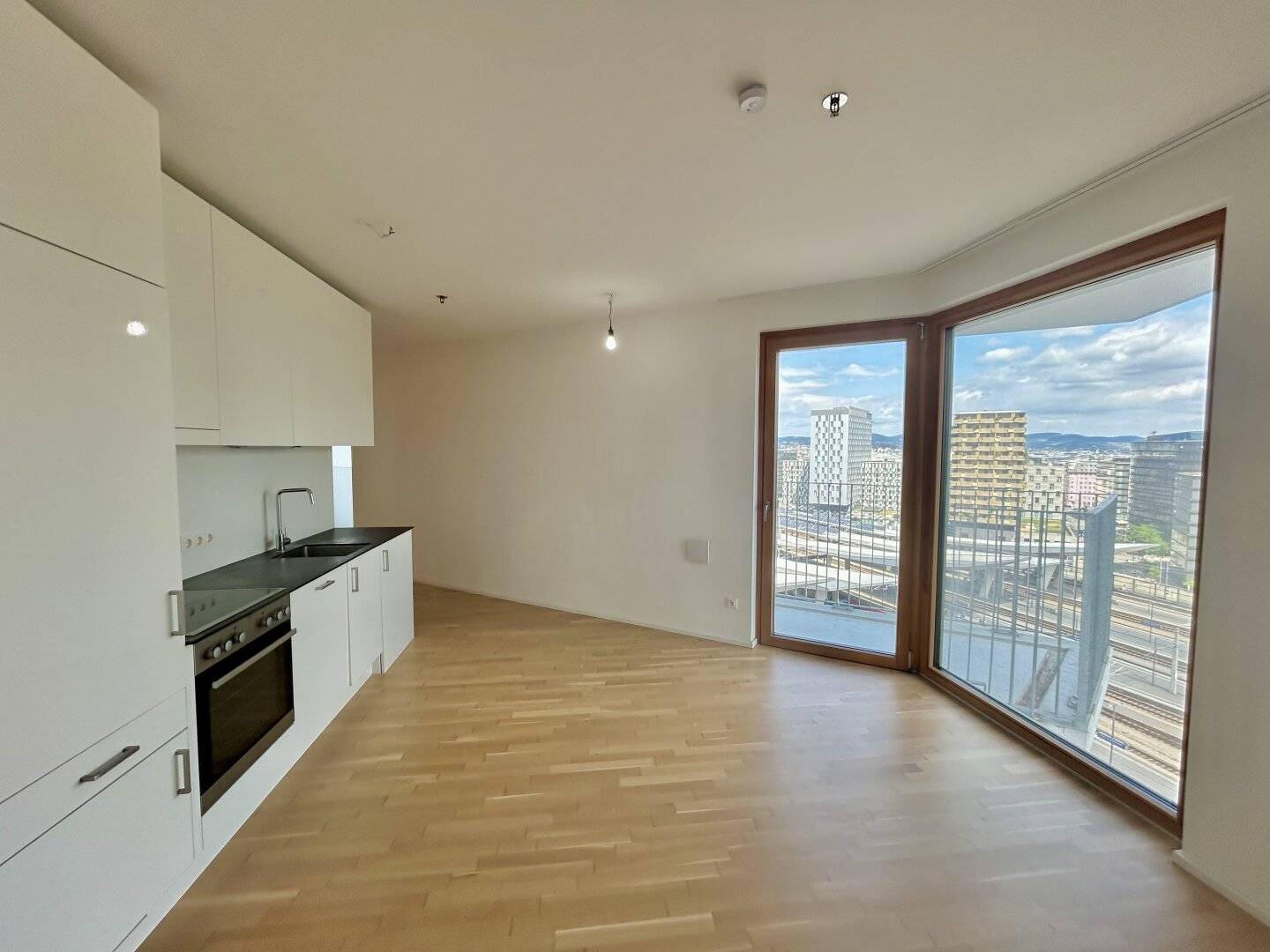 modern 1.5 room apartment on the 15th floor with generous outdoor space - Co-Working / Fitness center / Rooftop terrace included!