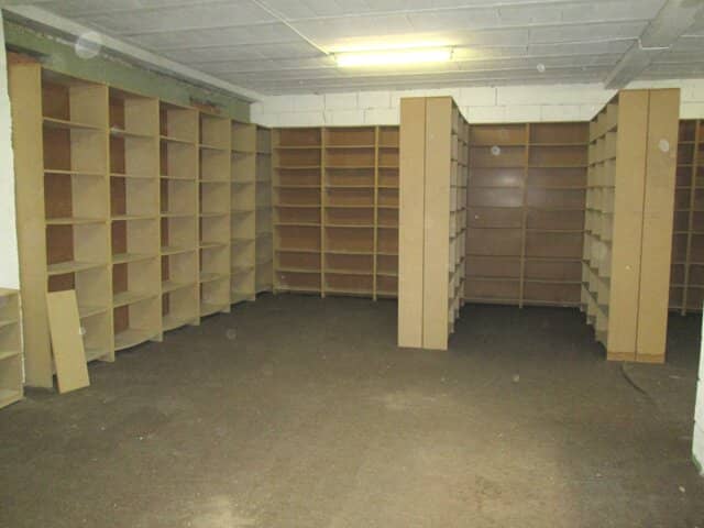 Dry courtyard-side storage on the ground floor, archive document storage or records storage
