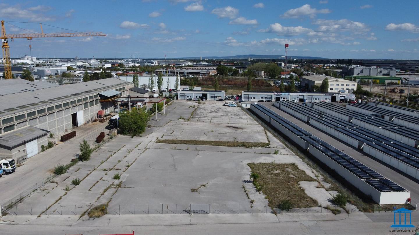 Paved, fenced open area optionally with building right or superstructure