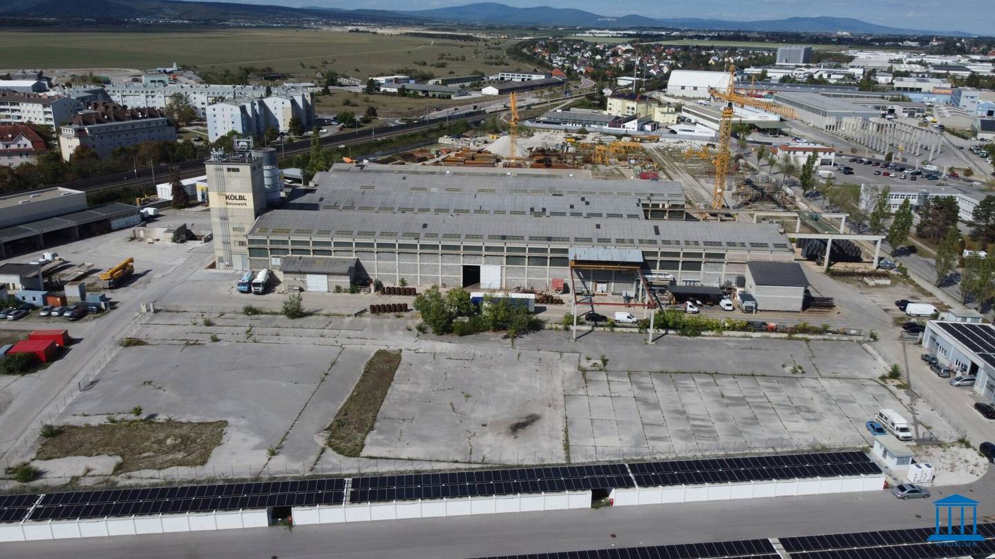 Paved, fenced open area optionally with building right or superstructure