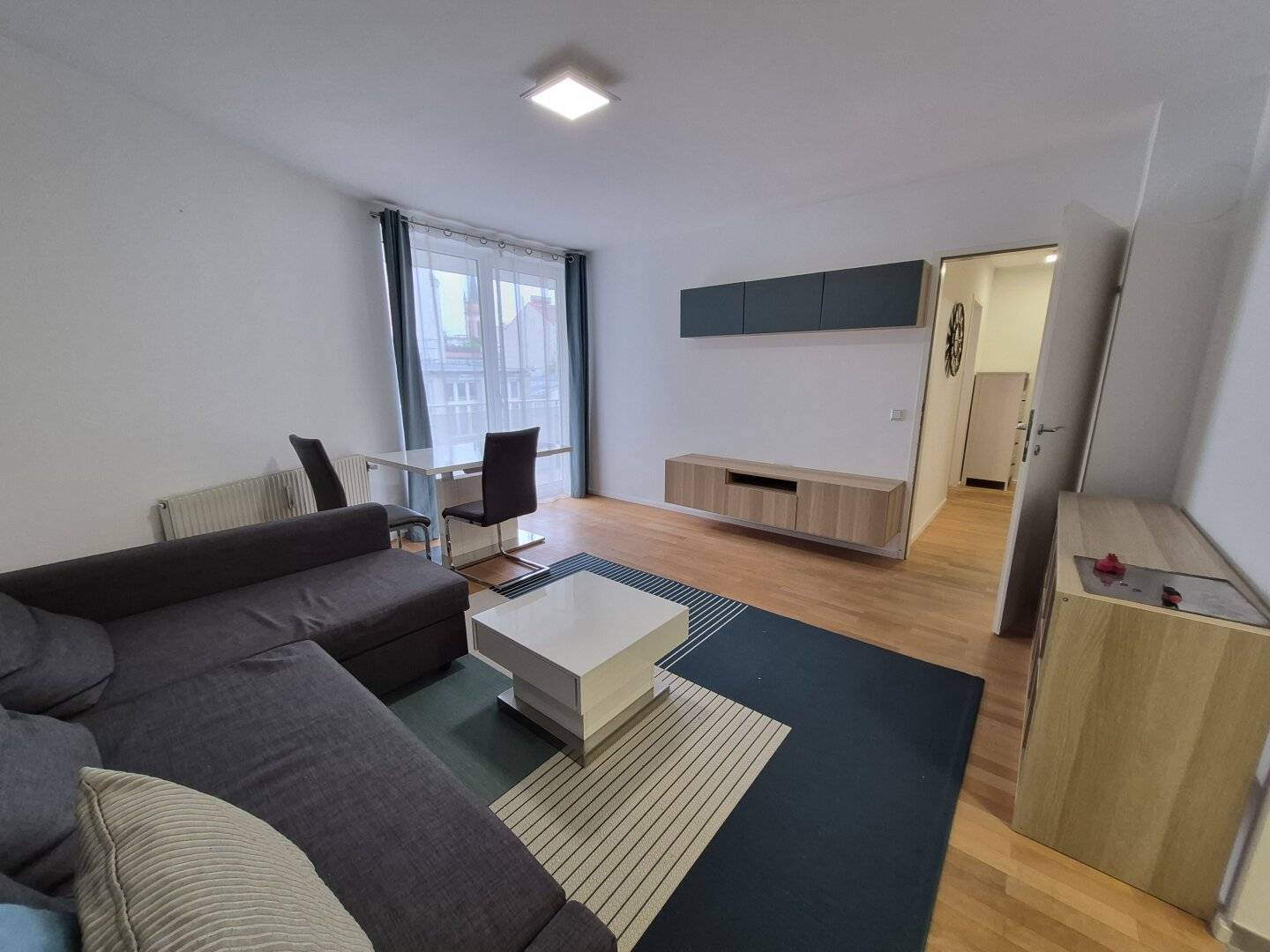 Inner courtyard oasis 2-room new-build apartment with balcony and optional garage space