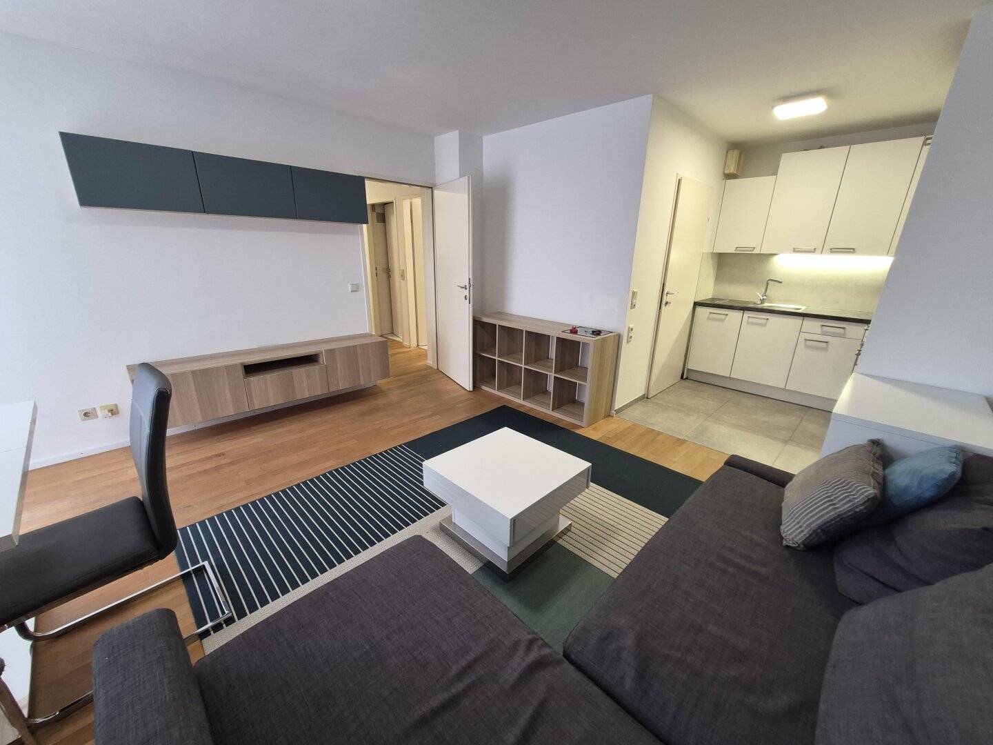 Inner courtyard oasis 2-room new-build apartment with balcony and optional garage space