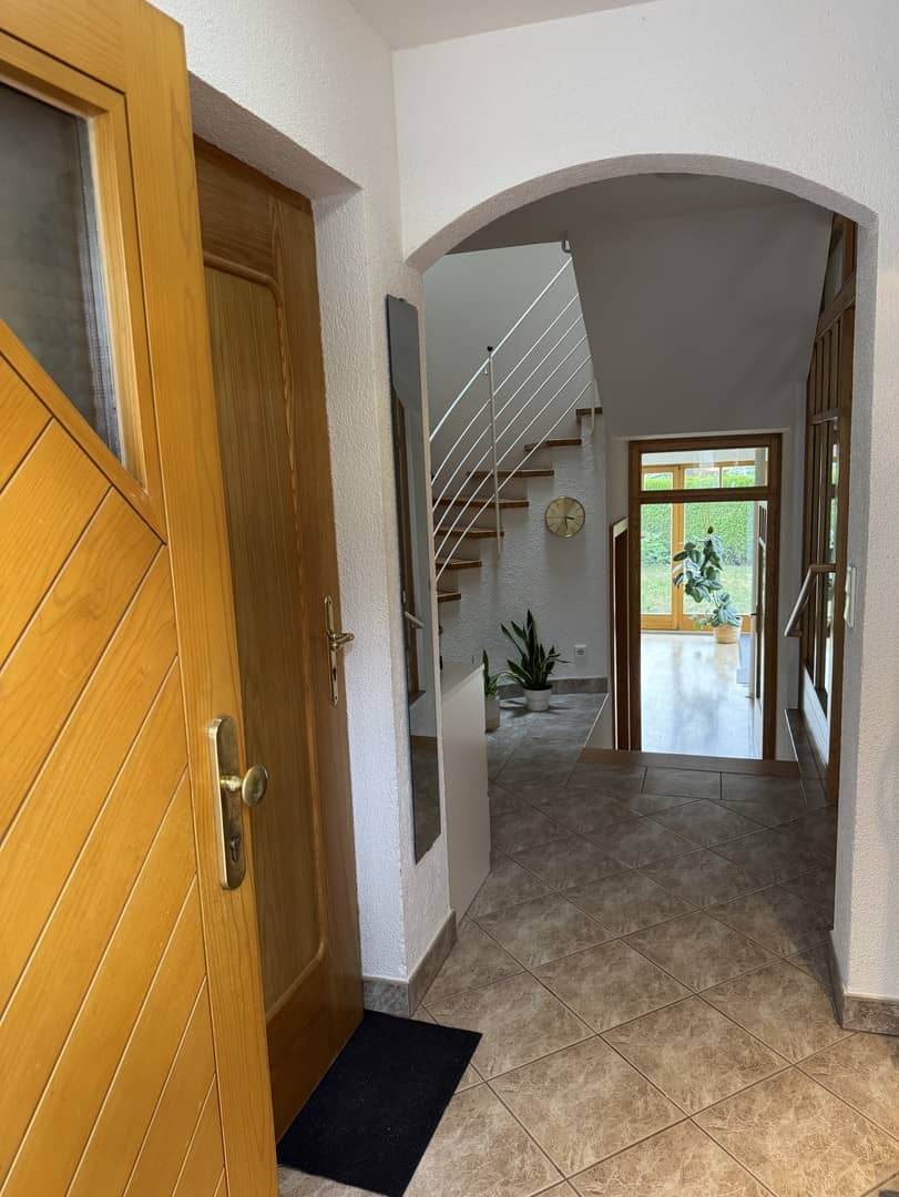 Sunny maisonette apartment with orangery and garden