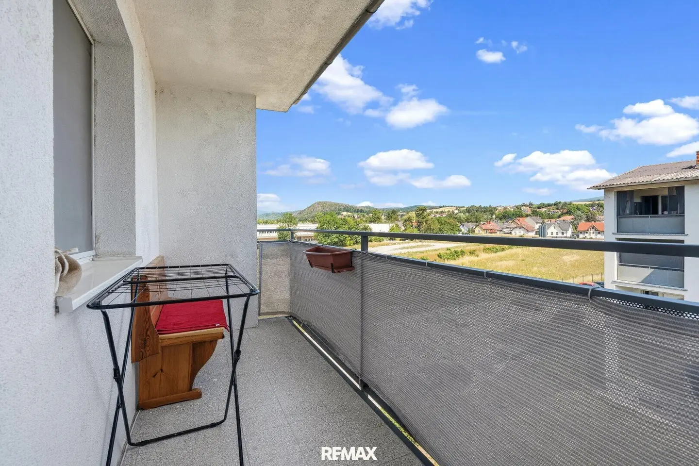 Stylish living with balcony and modern open-plan kitchen in Bernorf