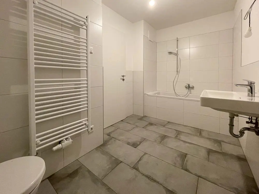 Ground floor apartment with private garden and carport