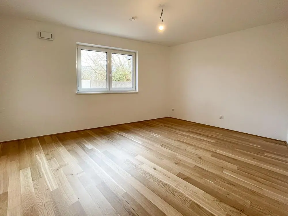 Ground floor apartment with private garden and carport