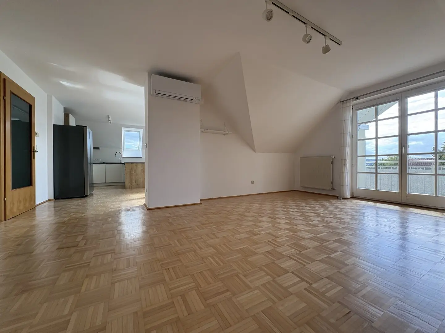 Well maintained condominium with southwest balcony, air conditioning and garage
