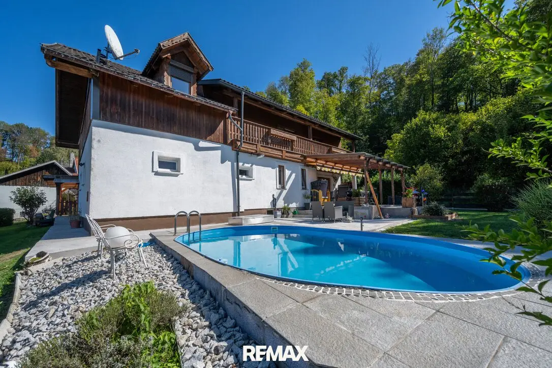GRÜNDBERGSIEDLUNG | Einfamilienhaus mit traumhaftem Garten, Pool, Carport &amp; Garage in sonniger Grünlage!