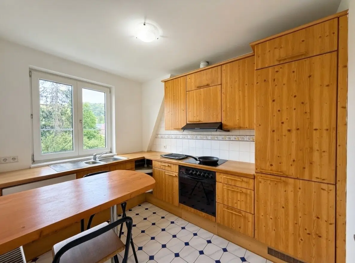Bright attic apartment with distant view and garage parking space