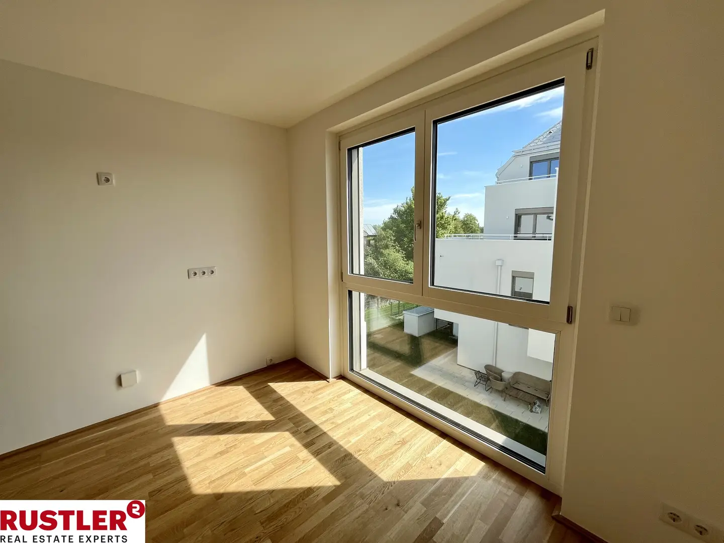 Modern apartment with photovoltaic system and green surroundings