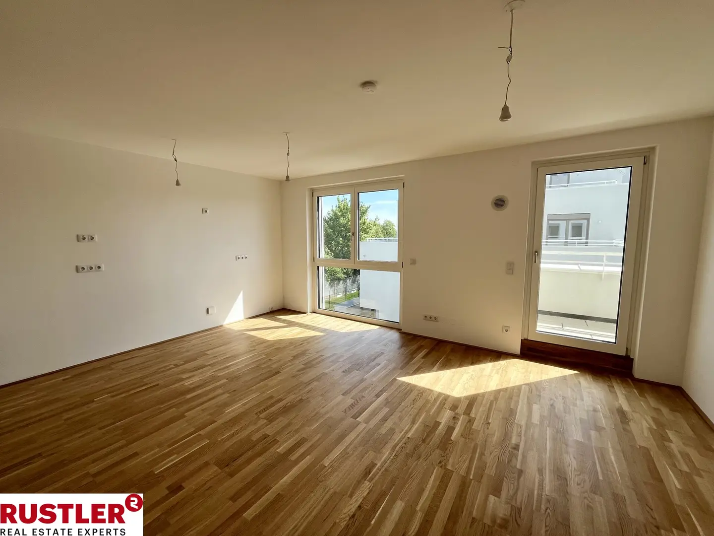 Modern apartment with photovoltaic system and green surroundings