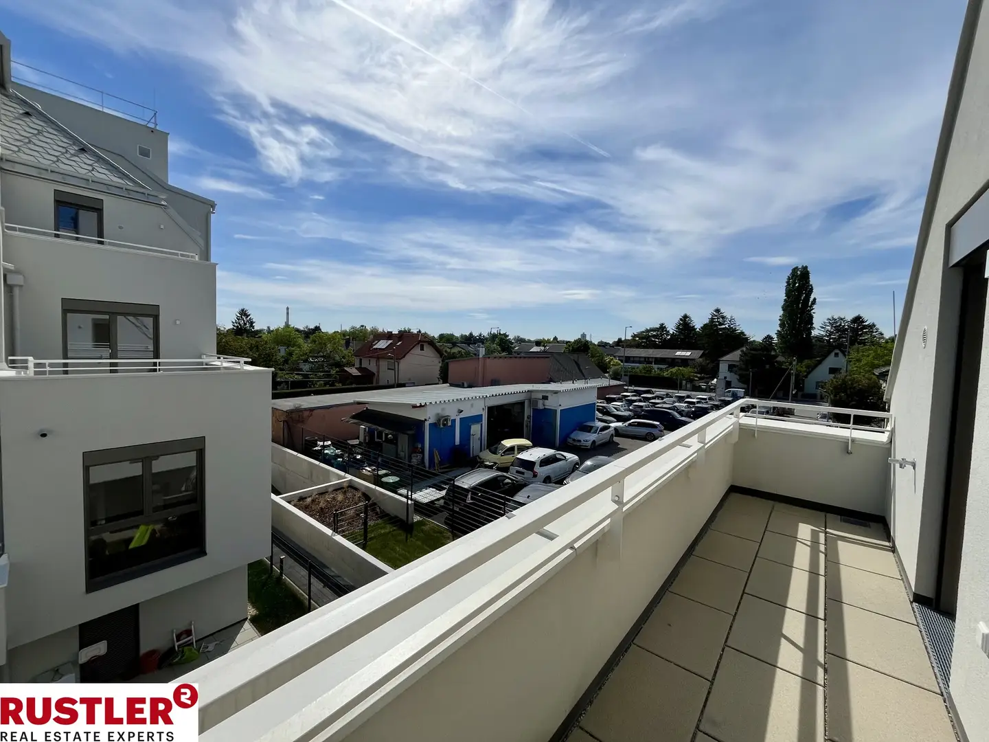 Modern apartment with photovoltaic system and green surroundings