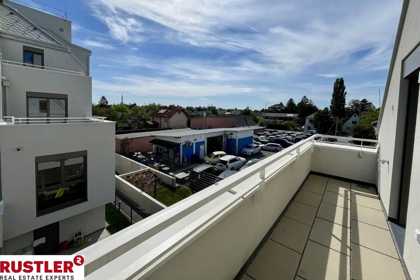 Modern apartment with photovoltaic system and green surroundings