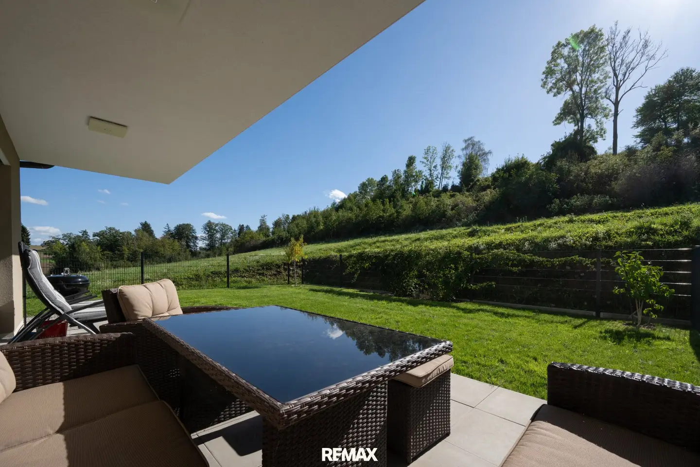 New build | High-quality garden apartment with dream kitchen, terrace and garage in quiet green location