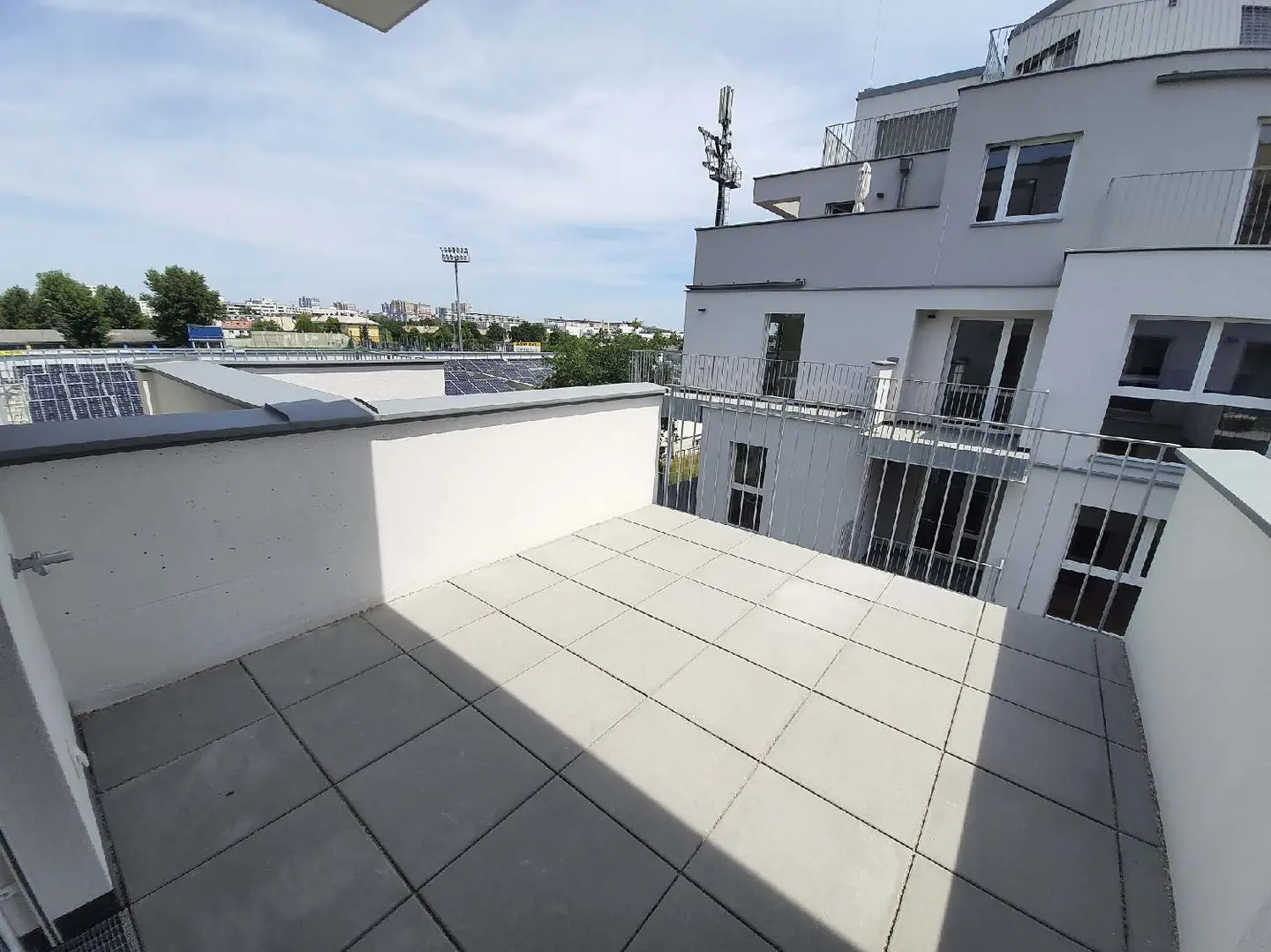 Modern apartment with balcony and green view