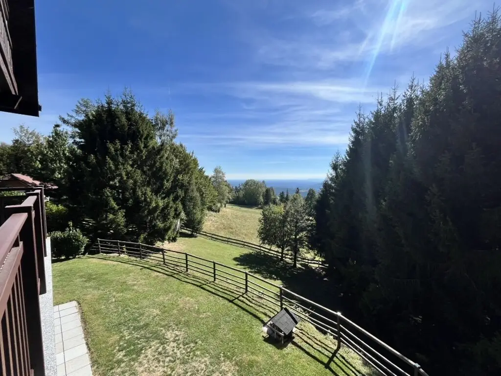 St. Radegung near Graz: A home with distant view – charming wooden house at the foot of the Schöckel in a magnificent elevated position only about 20 minutes from Graz