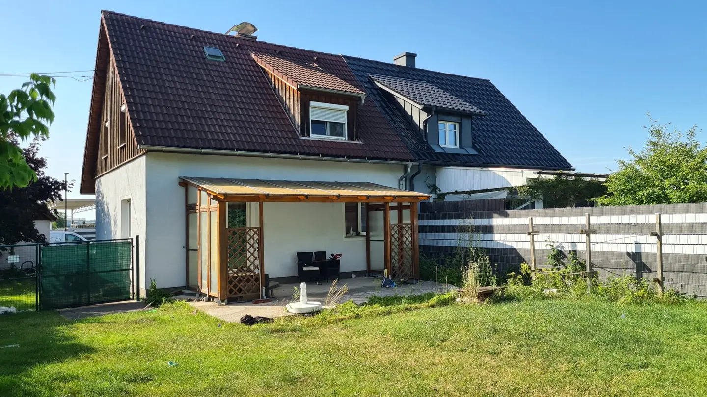 Older single family house with garage and large garden