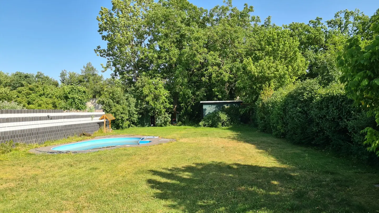 Older single family house with garage and large garden