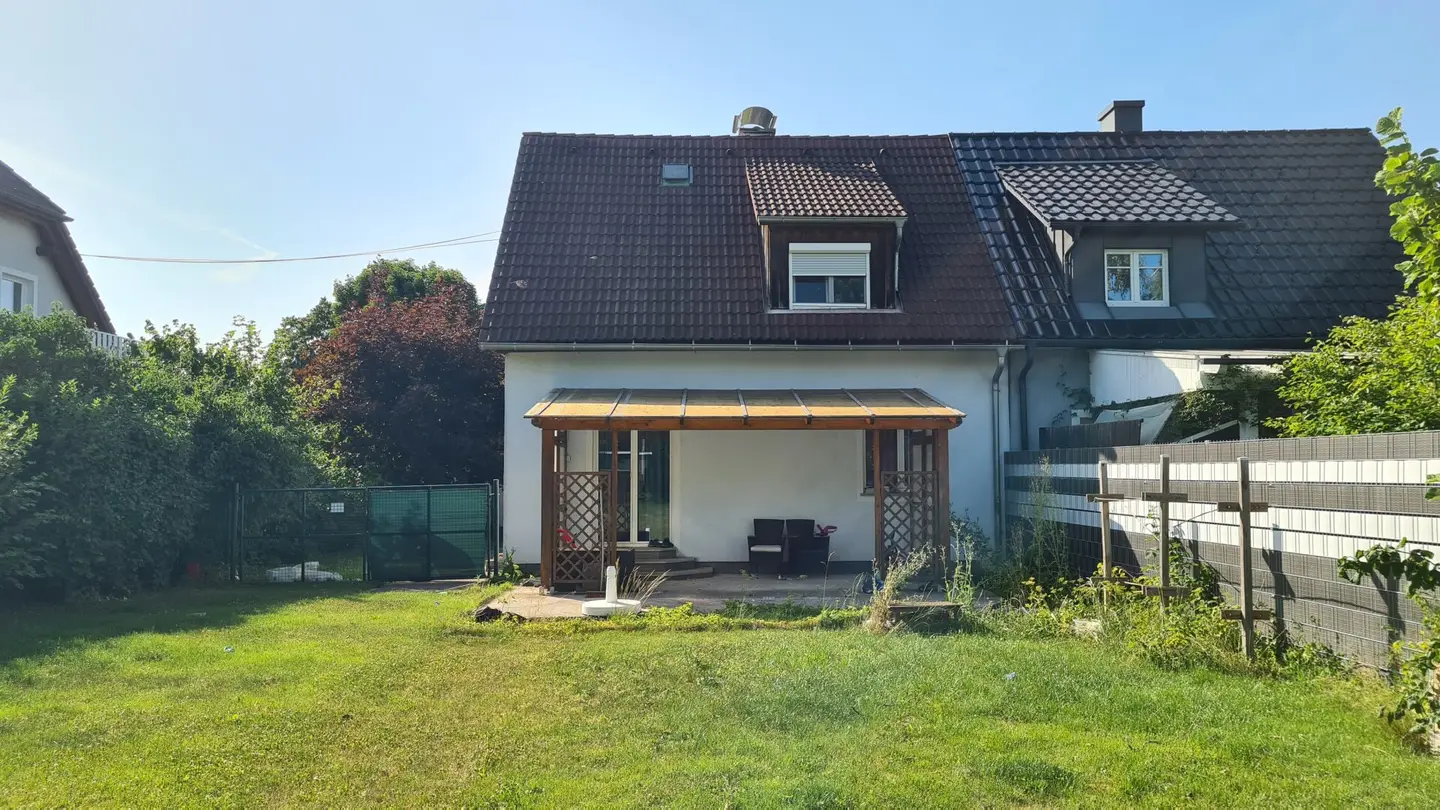 Older single family house with garage and large garden