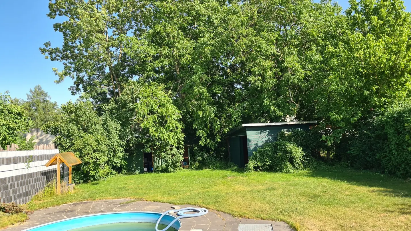 Older single family house with garage and large garden