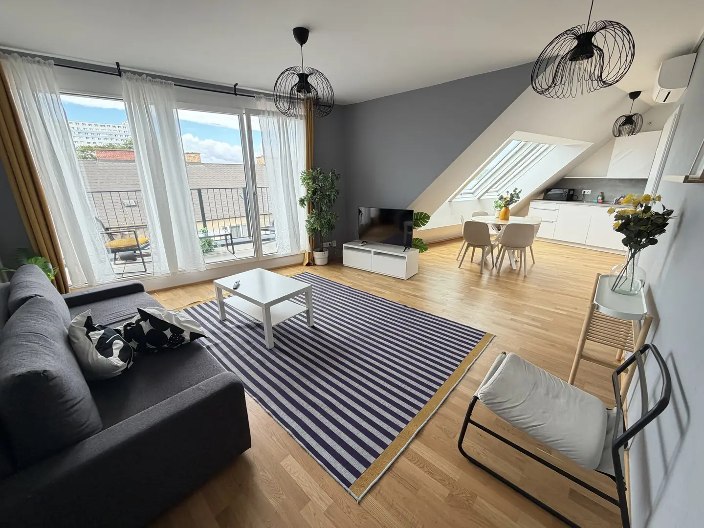 Fully furnished apartment with private outdoor space and oak flooring