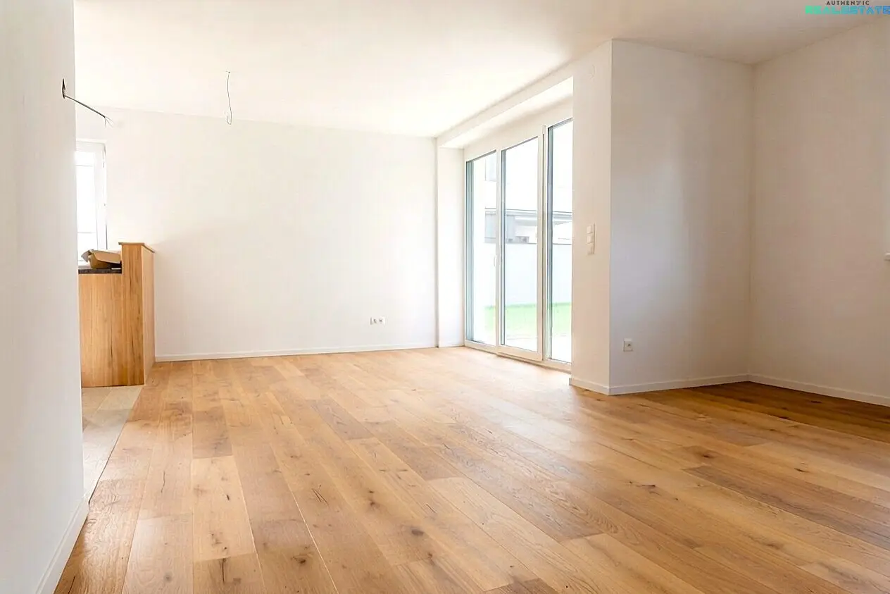 Modern first occupancy with distant view: Turnkey low-energy house including bespoke joiner kitchen and PV system.
